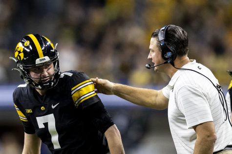 Iowa offensive coordinator Brian Ferentz talks with Iowa quarterback Spencer Petras during the Big Ten Championship game between No. 13 Iowa and No. 2 Michigan at Lucas Oil Stadium in Indianapolis, Indiana, on Saturday, Dec. 4, 2021. The Iowa offense recorded 279 total yards compared to Michigan’s 461. The Wolverines became Big Ten Champions after defeating the Hawkeyes, 42-3. 
