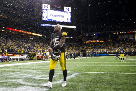 Iowa running back Tyler Goodson walks off the field after the Big Ten Championship game between No. 13 Iowa and No. 2 Michigan at Lucas Oil Stadium in Indianapolis, Indiana, on Saturday, Dec. 4, 2021. The Wolverines became Big Ten Champions after defeating the Hawkeyes, 42-3. 