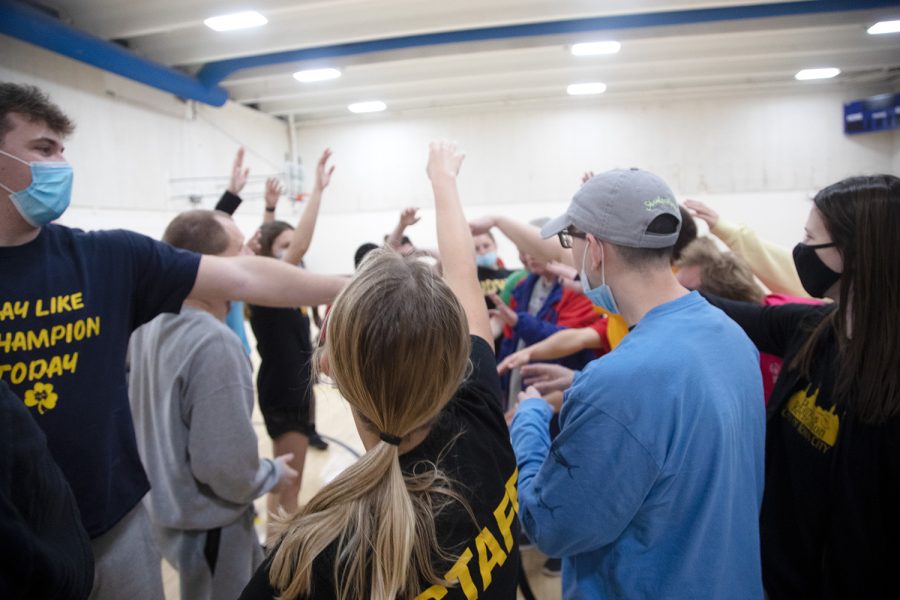 Unified Sports players and coaches put their hands in the middle during a practice at the Robert A Lee Recreation Center in Iowa City on Thursday, Dec. 2, 2021. The University of Iowa has become nationally recognized for its support of Unified Sports.