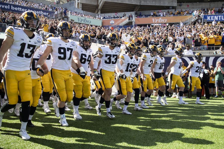 The Iowa Hawkeyes take the field during the 2022 Vrbo Citrus Bowl between No. 15 Iowa and No. 22 Kentucky at Camping World Stadium in Orlando, Fla., on Saturday, Jan. 1, 2022. The Wildcats defeated the Hawkeyes, 20-17.