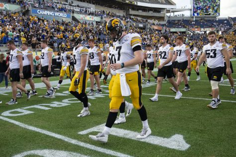 Iowa quarterback Spencer Petras walks off the field after the 2022 Vrbo Citrus Bowl between No. 15 Iowa and No. 22 Kentucky at Camping World Stadium in Orlando, Fla., on Saturday, Jan. 1, 2022. The Wildcats defeated the Hawkeyes, 20-17. Petras through as interception at the end of the game which gave Kentucky possession of the ball.