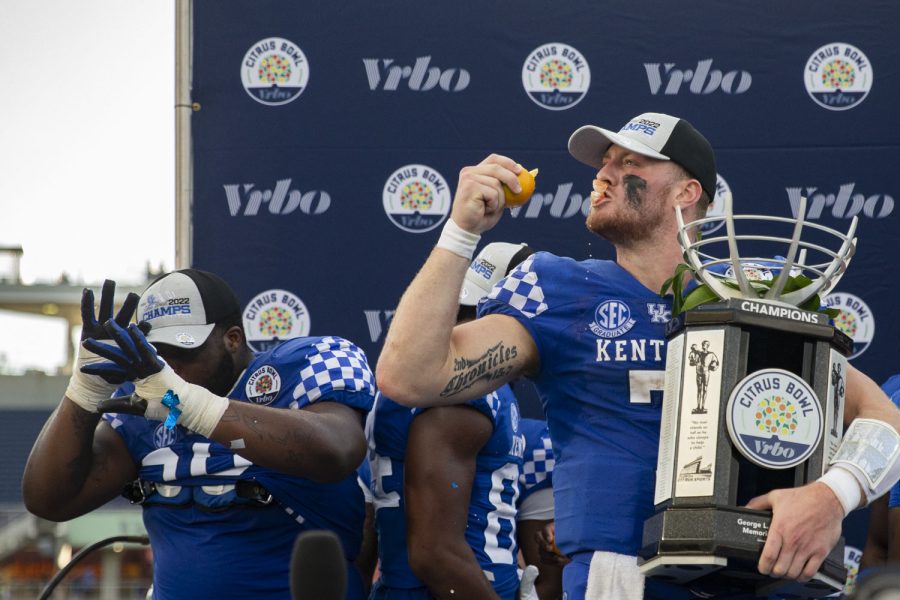 Kentucky quarterback Will Levis eats a whole orange while holding the Citrus Bowl Trophy after winning the the 2022 Vrbo Citrus Bowl between No. 15 Iowa and No. 22 Kentucky at Camping World Stadium in Orlando, Fla., on Saturday, Jan. 1, 2022. The Wildcats defeated the Hawkeyes, 20-17. During a press conference earlier in the week, head coach Mark Stoops was asked about Levis eating a banana with the peel.