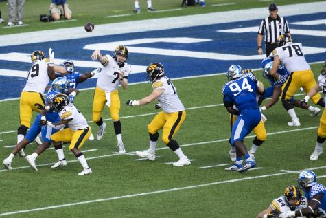 Iowa quarterback Spencer Petras releases a pass during the 2022 Vrbo Citrus Bowl between No. 15 Iowa and No. 22 Kentucky at Camping World Stadium in Orlando, Fla., on Saturday, Jan. 1, 2022. Petras threw for 211 yards. The Wildcats defeated the Hawkeyes, 20-17.