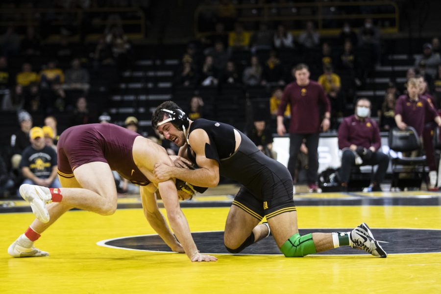 Iowa%E2%80%99s+No.+2+ranked+174-pound+Michael+Kemerer+grapples+Minnesota%E2%80%99s+No.+23+ranked+Bailee+O%E2%80%99Reilly.++during+a+wrestling+meet+between+No.+1+Iowa+and+No.+14+Minnesota+at+Carver-Hawkeye+Arena+on+Friday%2C+Jan.+7%2C+2022.+Kemerer+won+by+decision%2C+9-2.