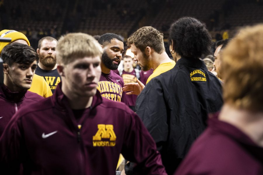 Minnesota’s No. 1 ranked 285-pound Gable Steveson shakes hands with Iowa’s No 5 ranked 197-pound Jacob Warner after a wrestling meet between No. 1 Iowa and No. 14 Minnesota at Carver-Hawkeye Arena on Friday, Jan. 7, 2022. Iowa now leads the all-time series 78-28-1. The Hawkeyes defeated the Gophers, 22-10.