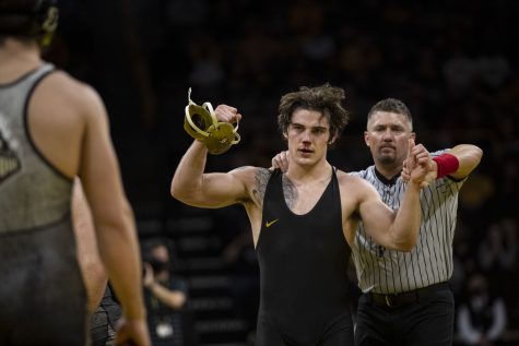 Iowa’s No. 18 184-pound Abe Assad celebrates a win over Purdues No. 23  Max Lyon during a wrestling meet between No. 1 Iowa and No. 15 Purdue in Carver-Hawkeye Arena on Sunday, Jan. 9, 2022. Assad won by decision, 6-3. The Hawkeyes defeated the Boilermakers, 36-4.
