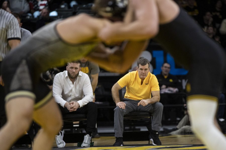 Iowa head coach Tom brands watches his team wrestle during a wrestling meet between No. 1 Iowa and No. 15 Purdue in Carver-Hawkeye Arena on Sunday, Jan. 9, 2022. After the win, Brands improved to 12-0 in his coaching career against Purdue. The Hawkeyes defeated the Boilermakers, 36-4.