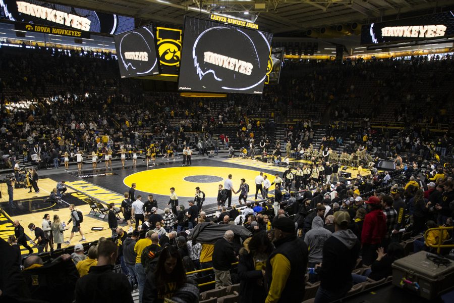 Iowa and Purdue players shake hands following a wrestling meet between No. 1 Iowa and No. 15 Purdue in Carver-Hawkeye Arena on Sunday, Jan. 9, 2022. The Hawkeyes defeated the Boilermakers, 36-4.