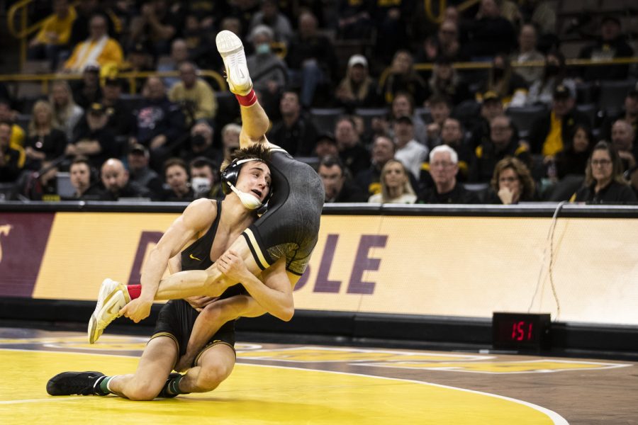Iowa%E2%80%99s+125-pound+Drake+Ayala+throws+down+Purdue%E2%80%99s+No.+5+Devin+Schoder+during+a+wrestling+meet+between+No.+1+Iowa+and+No.+15+Purdue+in+Carver-Hawkeye+Arena+on+Sunday%2C+Jan.+9%2C+2022.+Iowa+burned+Ayala%E2%80%99s+redshirt+after+Spencer+Lee+and+the+Hawkeyes+announced+his+decision+to+have+season-ending+surgery.+The+Hawkeyes+defeated+the+Boilermakers%2C+36-4.
