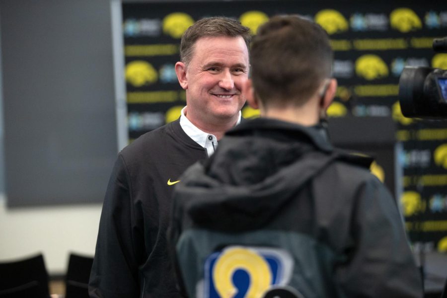Iowa’s new head volleyball coach Jim Barnes interacts with a tv reporter after a press conference introducing Barnes as head coach at Carver-Hawkeye Arena on Tuesday, Jan. 4, 2022. 