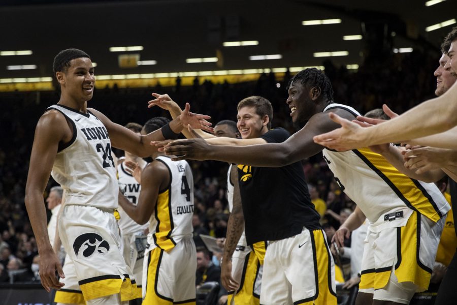 The Iowa bench cheers on forward Kris Murray during a men’s basketball game between Iowa and Indiana at Carver-Hawkeye Arena on Thursday, Jan. 13, 2022. The Hawkeyes defeated the Hoosiers, 83-74. Murray led the team in points with a new career-high of 29.
