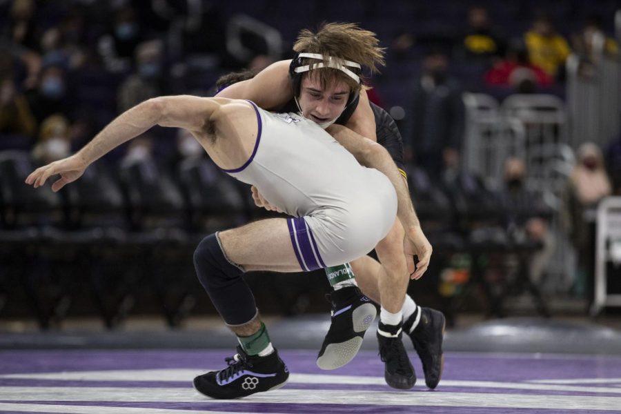 Iowa’s 125-pound No. 12 Drake Ayala wrestles Northwestern’s No. 7 Michael DeAugustino during a dual at Welsh-Ryan Arena in Evanston, IL. Ayala defeated DeAugustino by decision 6-5 in his second consecutive win against a top 10 opponent.