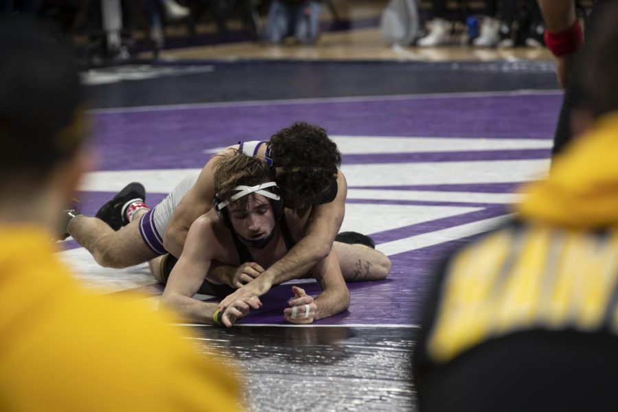 Iowa’s 141-pound Drew Bennett wrestles Northwestern’s No. 32 Frank Tal Shahar during a dual at Welsh-Ryan Arena in Evanston, IL. Tal Shahar defeated Bennett by decision 10-6.
