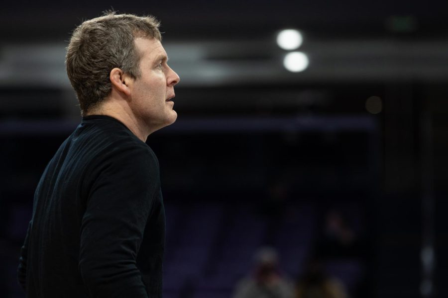 Iowa Head Coach Tom Brands watches the mat during a dual between No. 2 Iowa and No. 23 Northwestern at Welsh-Ryan Arena in Evanston, IL The Hawkeyes defeated the Wildcats 33-6.