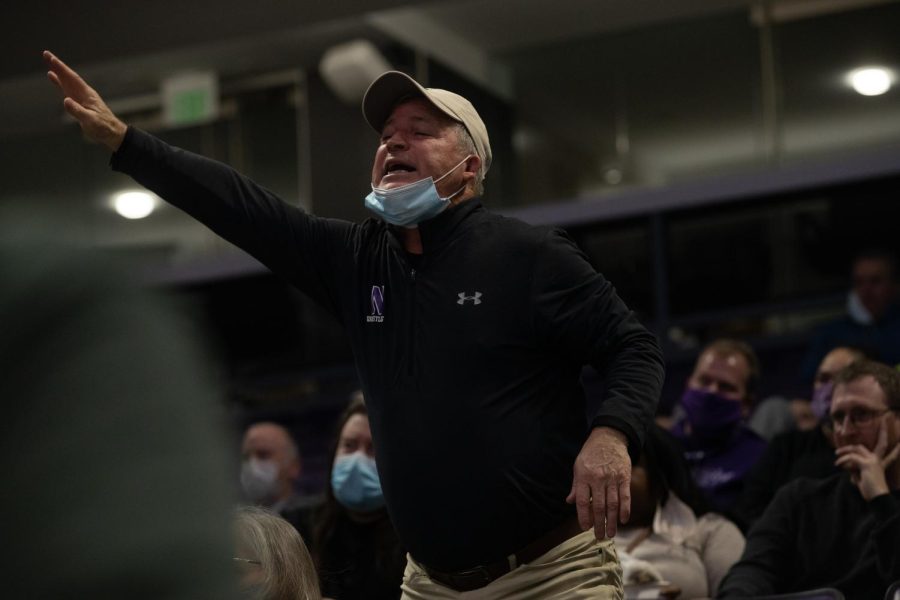 A Northwestern fan shouts from the stands during a dual at Welsh-Ryan Arena in Evanston, IL.