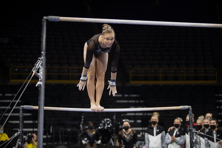 Iowa junior Allyson Steffensmeier performs on the bars during a gymnastics meet between Iowa and Texas Women’s University at Carver-Hawkeye Arena on Friday, Jan. 14, 2022. Steffensmeier finished with 9.875 points on the bars. The Hawkeyes defeated the Pioneers, 196.125-189.300.