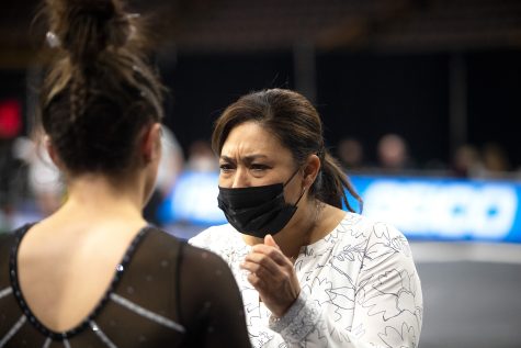 Iowa head coach Larissa Libby instructs her team during a gymnastics meet between Iowa and Texas Women’s University at Carver-Hawkeye Arena on Friday, Jan. 14, 2022. The Hawkeyes defeated the Pioneers, 196.125-189.300.