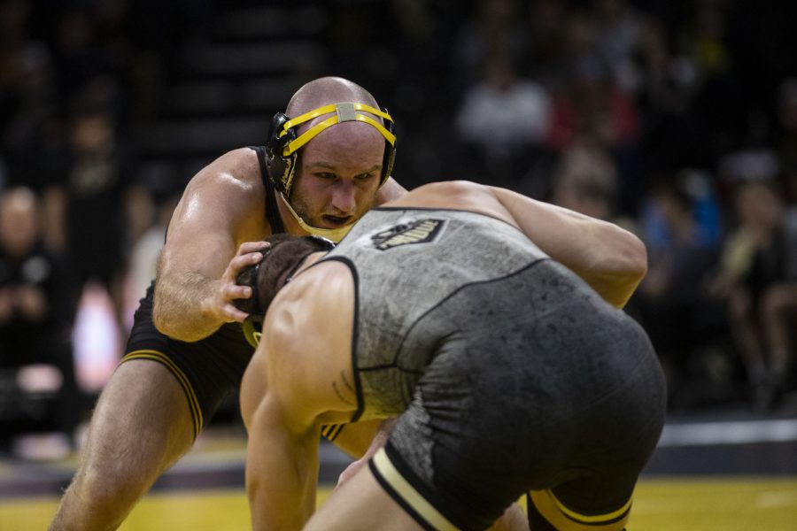 Iowa%E2%80%99s+No.+1+165-pound+Alex+Marinelli+grabs+Purdues+Hayden+Lohrey+during+a+wrestling+meet+between+No.+1+Iowa+and+No.+15+Purdue+in+Carver-Hawkeye+Arena+on+Sunday%2C+Jan.+9%2C+2022.+Marinelli+won+by+technical+fall%2C+22-7.+Marinelli+was+in+the+lead+for+all+three+periods.+The+Hawkeyes+defeated+the+Boilermakers%2C+36-4.