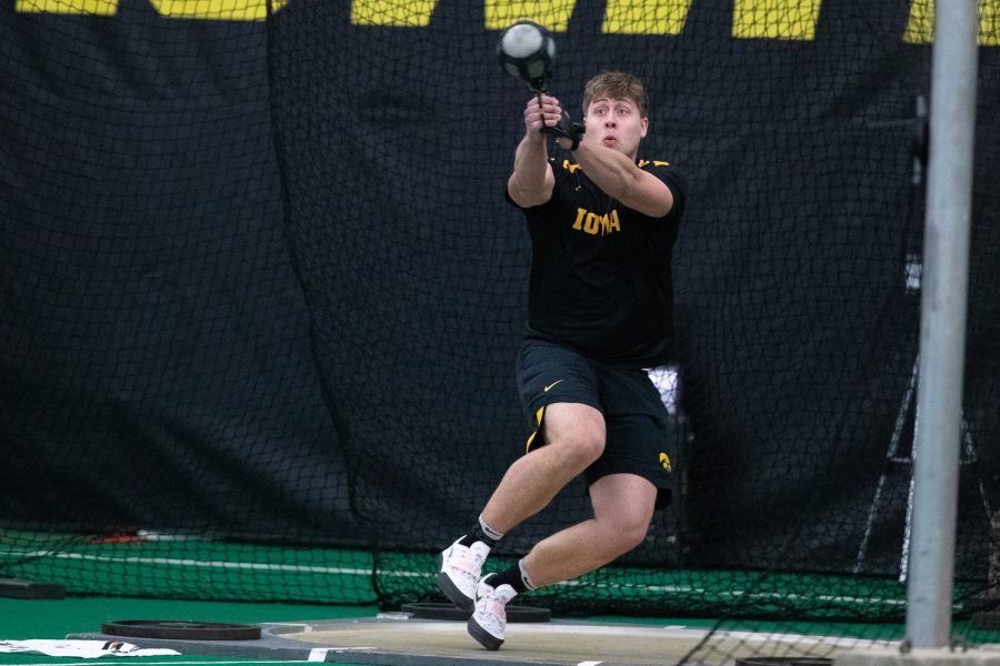 Iowas Jordan Hawkins prepares to release a weight during the mens weight throw at the 2022 Larry Wieczorek Invitational track and field meet at the Hawkeye Tennis and Recreation Center on Friday, Jan. 21, 2022. The Larry Wieczorek Invitational hosted Baylor, Gonzaga, Northern Iowa, Purdue, and Wisconsin.