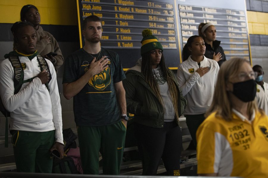 Baylor athletes stand for the national anthem during the Larry Wieczorek Invitational Track Meet at the Hawkeye Indoor Track Facility on Jan. 22, 2022. The Larry Wieczorek Invitational hosted Wisconsin, Purdue, Northern Iowa, Gonzaga, and Baylor.