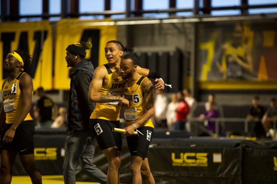 Jenoah McKiver of Iowa’s Men’s 4x400-meter relay team embraces teammate and anchor, Julien Gillum, after winning first and owning the relay’s fastest time of the meet with 3:07.85 at the Larry Wieczorek Invitational inside the Iowa Recreation Building on January 22, 2022. The Larry Wieczorek Invitational hosted Baylor, Gonzaga, Purdue, Northern Iowa,  Wisconsin, Simpson, Wartburg, British Athletics and unattached runners.