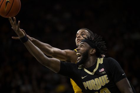 Purdue forward Trevion Williams goes up for a shot during a basketball game between Iowa and No. 6 Purdue at Carver-Hawkeye Arena in Iowa City on Thursday, Jan. 27, 2022. The Boilermakers defeated the Hawkeyes, 83-73. Williams played a total of 24 minutes and five seconds.