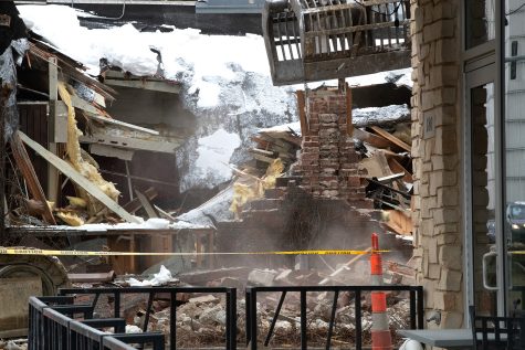 A bulldozer demolishes The Mill on Thursday, Jan. 27, 2022. The Mill was known as an art and concert venue for Iowa City artists and musicians before closing in June 2020.