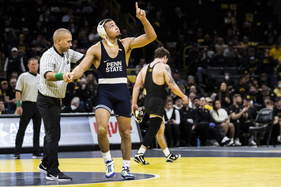 Penn State’s No. 1 184-pound Aaron Brooks points up after defeating Iowa’s No. 17 Abe Assad, 8-3, during a wrestling meet between No. 2 Iowa and No. 1 Penn State in Carver-Hawkeye Arena on Friday, Jan. 28, 2022. The Nittany Lions defeated the Hawkeyes, 19-13.