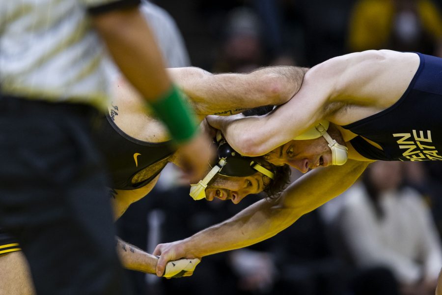Penn State’s No. 1 141-pound Nick Lee grapples with Iowa’s No. 2 Jaydin Eierman during a wrestling meet between No. 2 Iowa and No. 1 Penn State in Carver-Hawkeye Arena on Friday, Jan. 28, 2022. Lee defeated Eierman, 6-4.
