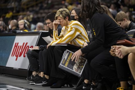 Iowa associate head coach Jan Jensen puts her hand on her head during a women’s basketball game between No. 22 Iowa and Northwestern at Carver-Hawkeye Arena on Thursday, Jan. 6, 2022. The Wildcats defeated the Hawkeyes, 77-69. 