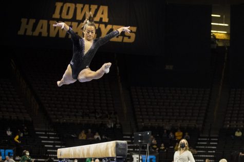 Iowa’s Adeline Kenlin competes on beam during a gymnastics meet between No. 18 Iowa and Eastern Michigan at Carver-Hawkeye Arena on Saturday, Jan. 8, 2022. Kenlin was named Big Ten freshman of the year last season. The Hawkeyes defeated the Eagles 195.950-194.100. 