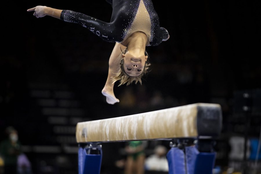 Iowa’s Adeline Kenlin competes on beam during a gymnastics meet between No. 18 Iowa and Eastern Michigan at Carver-Hawkeye Arena on Saturday, Jan. 8, 2022. Kenlin scored 9.925 in the event. The Hawkeyes defeated the Eagles 195.950-194.100. 