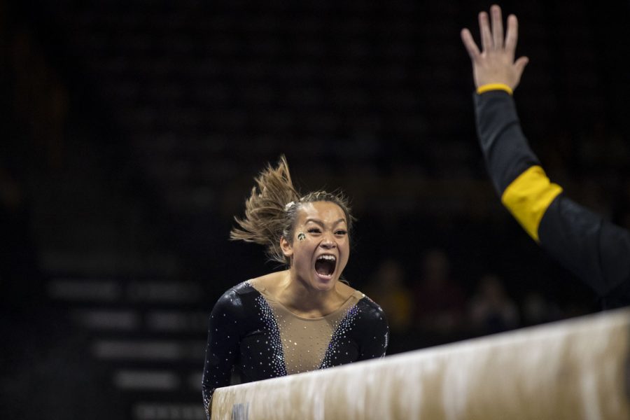 Iowa%E2%80%99s+Adeline+Kenlin+celebrates+after+competing+on+beam+during+a+gymnastics+meet+between+No.+18+Iowa+and+Eastern+Michigan+at+Carver-Hawkeye+Arena+on+Saturday%2C+Jan.+8%2C+2022.+Kenlin+placed+first+on+beam.+The+Hawkeyes+defeated+the+Eagles+195.950-194.100.+