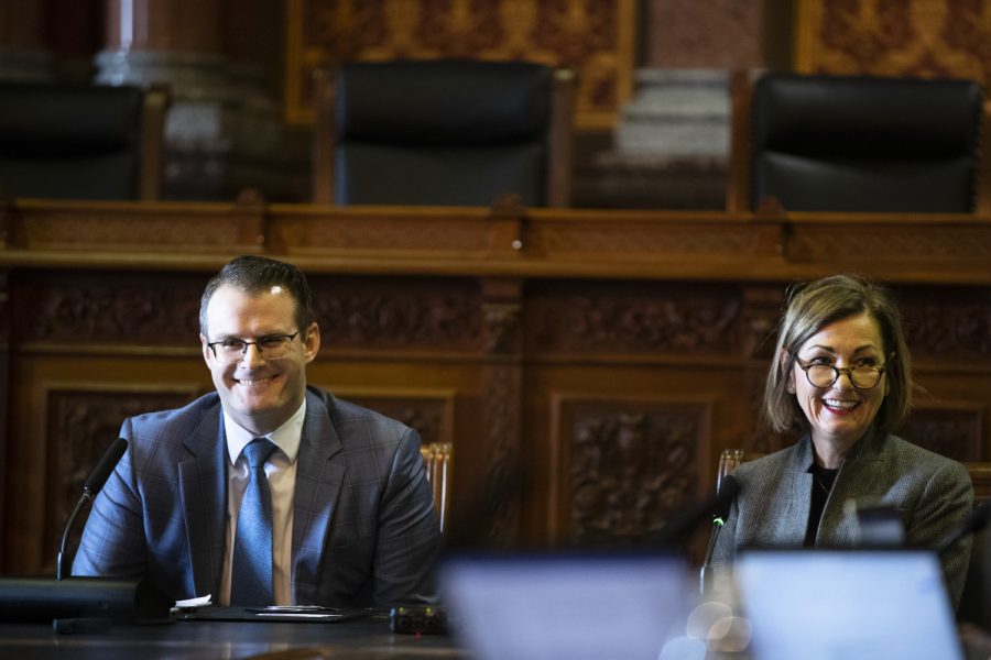 Lt. Gov. Adam Gregg  and Iowa Gov. Kim Reynolds smile after Reynolds made a joke at a press conference at the Iowa State Capitol in Des Moines, Iowa on Tuesday, January 4, 2022.. (Gabby Drees/The Daily Iowan)