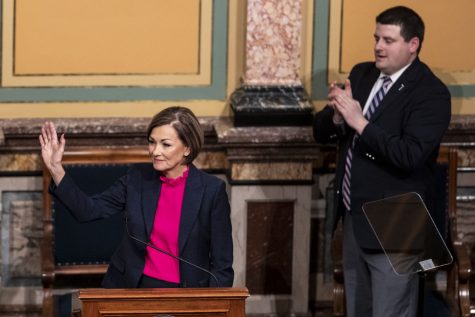 Iowa Governor Kim Reynolds waves to attendees and legislative members during the conclusion of the Condition of the State Address at the Iowa State Capitol in Des Moines, Iowa, on Tuesday, Jan. 11, 2022. During the State Address, Reynolds spoke about childcare, Iowa teachers, material taught in schools, unemployment, tax cuts, and more.