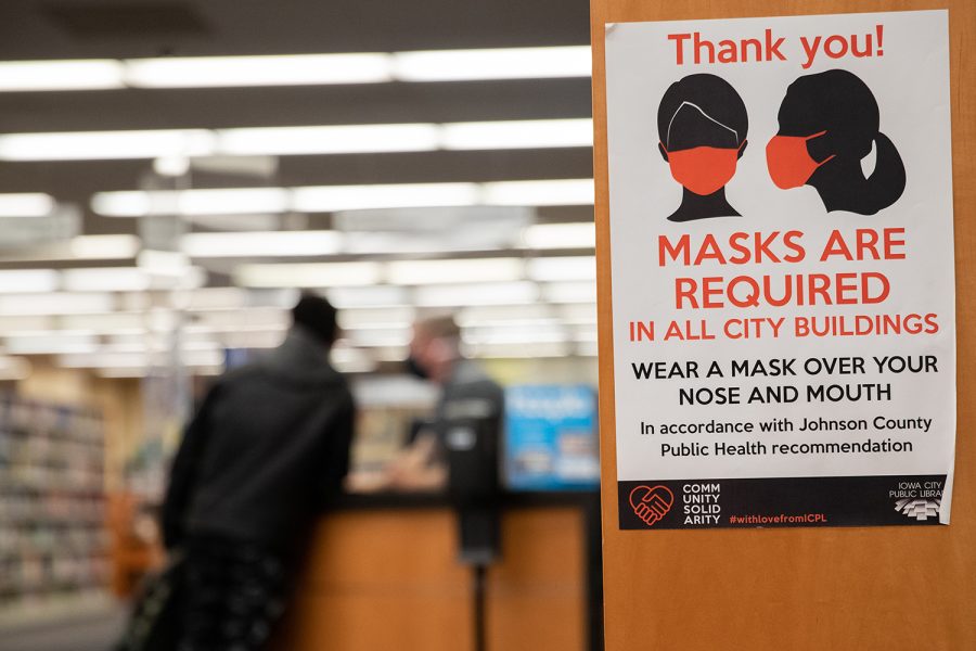 The Iowa City Public Library is shown with mask mandate signs in Iowa City on Monday, Jan. 17, 2022. 