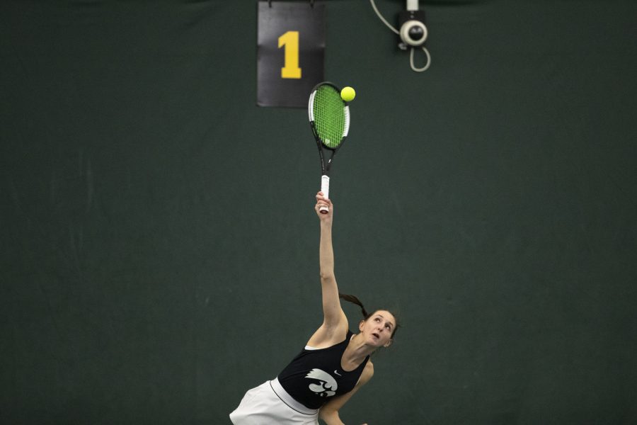 Iowa’s Marisa Schmidt serves the ball during a tennis match between Iowa and Drake at Hawkeye Tennis and Recreation Complex in Iowa City on Sunday, Jan. 16, 2022. Schmidt defeated Drake’s Ines Stephani. Iowa beat Drake, 6-1.