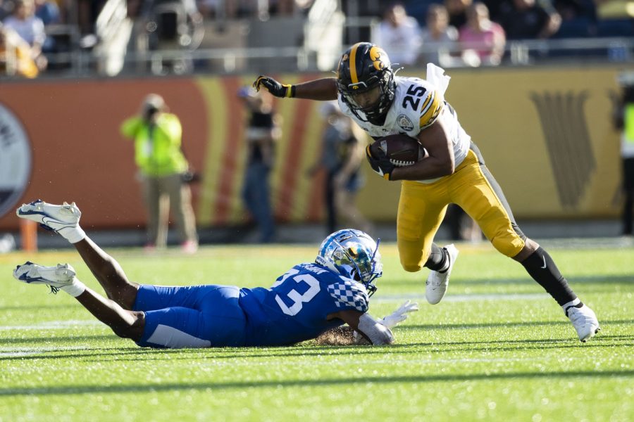 Iowa running back Gavin Williams carries the ball during the 2022 Vrbo Citrus Bowl between No. 15 Iowa and No. 22 Kentucky at Camping World Stadium in Orlando, Fla., on Saturday, Jan. 1, 2022. The Wildcats defeated the Hawkeyes, 20-17. Williams carried the ball 16 times for 42 yards.