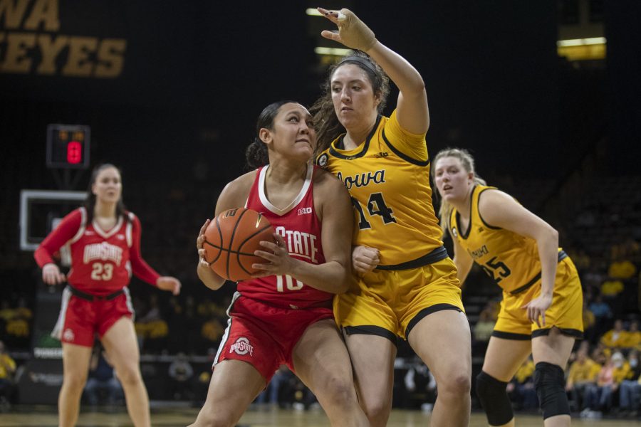 Ohio State guard Braxtin Miller drives to the basket while guarded by Iowa forward McKenna Warnock during a women’s basketball game between No. 21 Iowa and No. 23 Ohio State at Carver-Hawkeye Arena in Iowa City on Monday, Jan. 31, 2022. The Buckeyes defeated the Hawkeyes, 92-88.