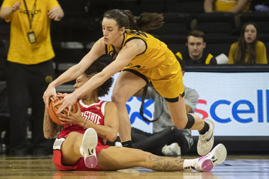 Iowa guard Caitlin Clark and Ohio State guard Rikki Harris battle for a loose ball. Ohio State forced 14 turnovers against Iowa, giving up 7 turnovers during a women’s basketball game between No. 21 Iowa and No. 23 Ohio State at Carver-Hawkeye Arena in Iowa City on Monday, Jan. 31, 2022. The Buckeyes defeated the Hawkeyes, 92-88. 