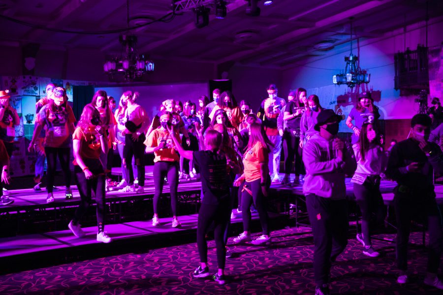 Participants walk off the stage during Dance Marathon at the Iowa Memorial Union at the University of Iowa in Iowa City on Saturday, Feb. 5, 2022. The fundraiser was held virtually with limited in-person participants. 