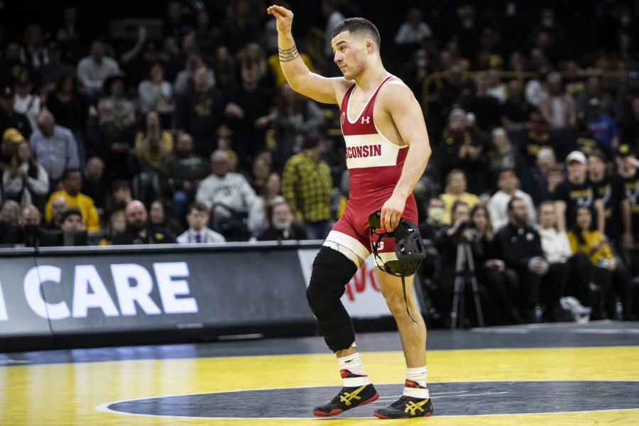 Wisconsin's 149-pound Austin Gomez celebrates his victory over Iowa's Vince Turk during a wrestling meet between No. 2 Iowa and No. 9 Wisconsin in Carver-Hawkeye Arena on Saturday, Feb. 5, 2022. Gomez defeated Turk by decision, 3-2. The Hawkeyes defeated the Badgers, 29-6.