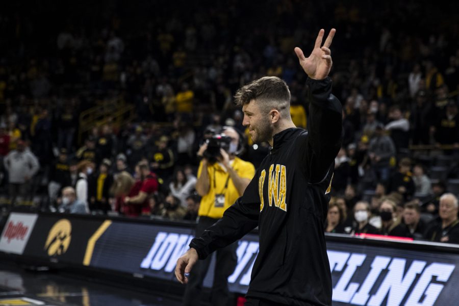 Iowa’s No. 2 141-pound Jaydin Eierman waves to the fans following a wrestling meet between No. 2 Iowa and No. 9 Wisconsin in Carver-Hawkeye Arena on Saturday, Feb. 5, 2022. Eierman was one of eight seniors celebrated following the meet. The Hawkeyes defeated the Badgers, 29-6.