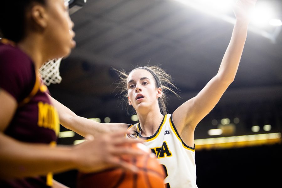 Iowa guard Caitlin Clark attempts to block while Minnesota throws the ball in during a basketball game between Iowa and Minnesota at Carver-Hawkeye Arena in Iowa City on Wednesday, Feb. 9, 2022. Clark earned one block. The Hawkeyes beat the Golden Gophers, 88-78.