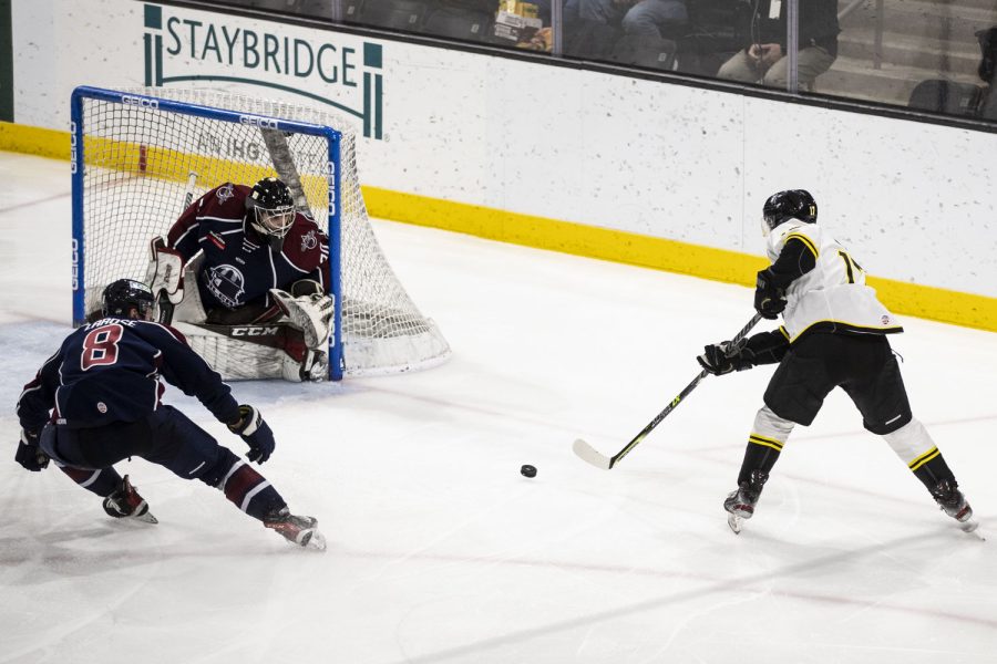 Heartlander forward Yuki Miura shoots a goal during a hockey game between the Iowa Heartlanders and the Tulsa Oilers at Xtream Arena in Coralville, Iowa, on Wednesday, Feb. 16, 2022. The Heartlanders defeated the Oilers in a shootout, 4-3. Miura scored one goal for the Heartlanders.