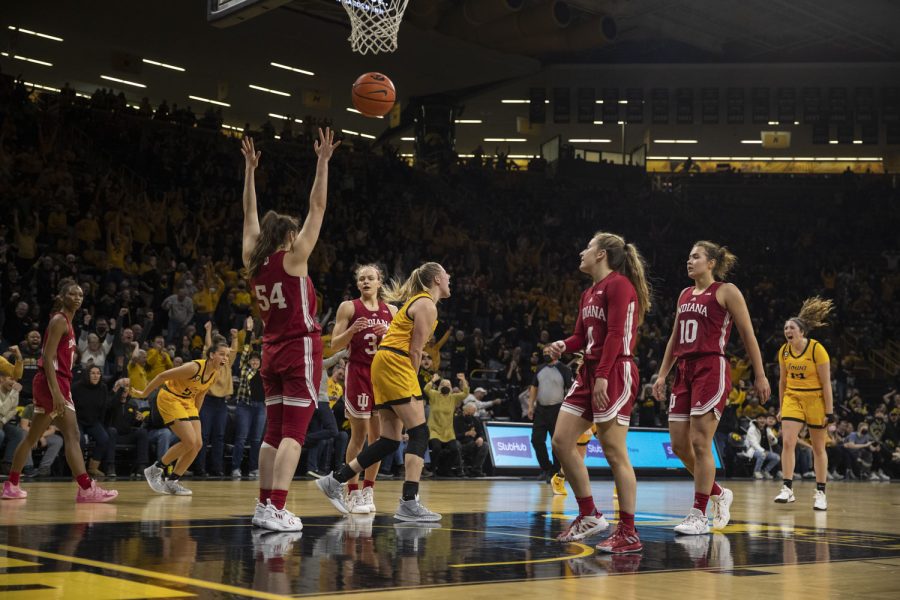 Iowa celebrates a basket score by Monika Czinano during a women’s basketball game between No. 21 Iowa and No. 10 Indiana at Carver-Hawkeye Arena in Iowa City on Monday, Feb. 21, 2022. The Hawkeyes defeated the Hoosiers, 88-82.