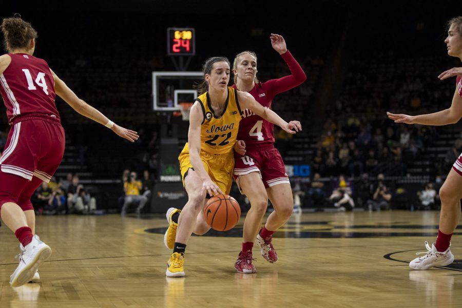 Iowa guard Caitlin Clark drives to the basket during a women’s basketball game between No. 21 Iowa and No. 10 Indiana at Carver-Hawkeye Arena in Iowa City on Monday, Feb. 21, 2022. Clark was second in scoring with 29 points. The Hawkeyes defeated the Hoosiers, 88-82.  