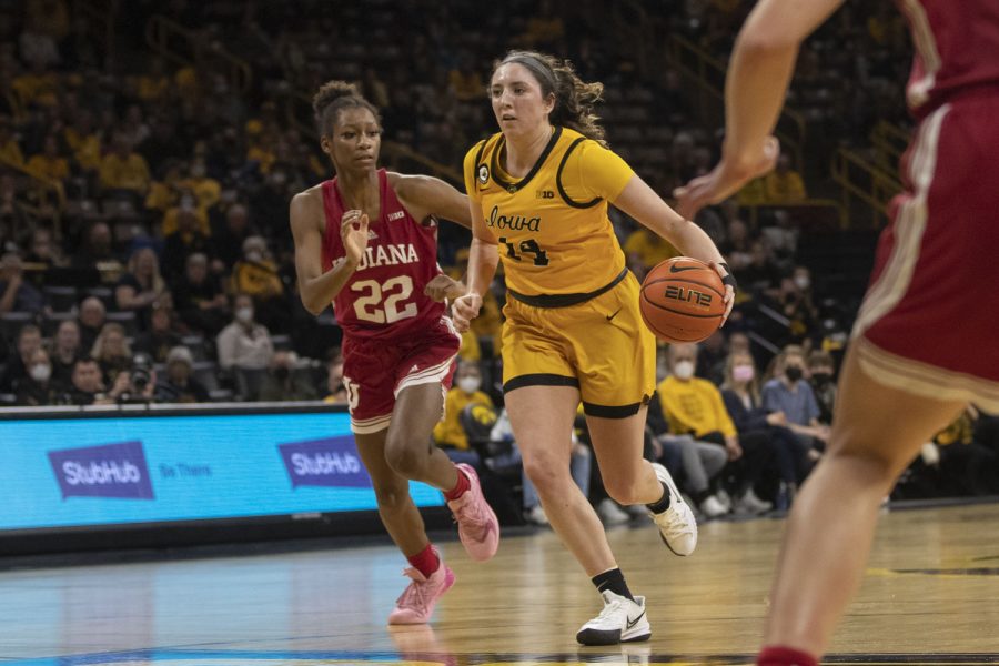 Iowa forward McKenna Warnock drives to the basket. during a women’s basketball game between No. 21 Iowa and No. 10 Indiana at Carver-Hawkeye Arena in Iowa City on Monday, Feb. 21, 2022. Warnock scored 16 points. The Hawkeyes defeated the Hoosiers, 88-82.