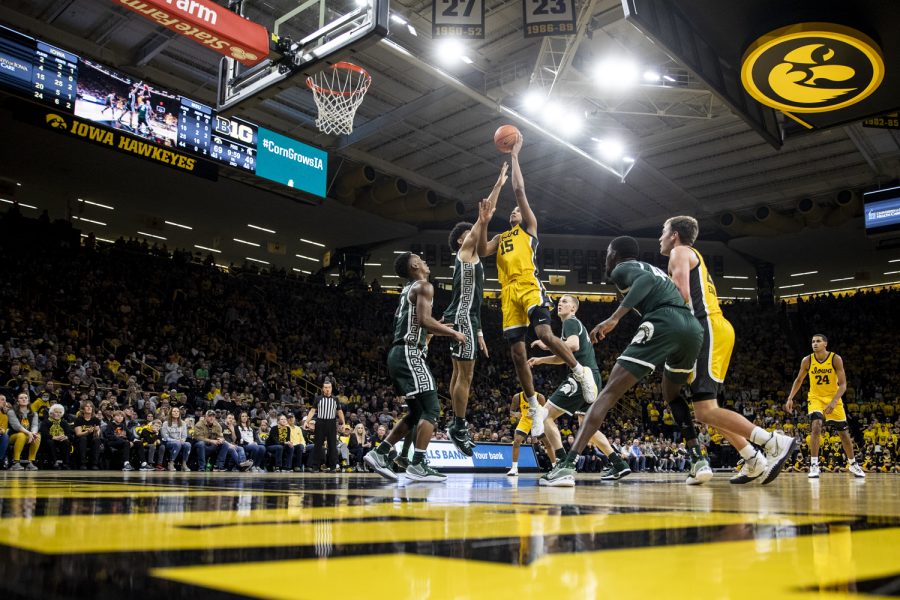 Iowa forward Keegan Murray fights through traffic for a score during a men’s basketball game at Carver-Hawkeye Arena between No. 25 Iowa and Michigan State on Tuesday, Feb. 22, 2022. Murray shot 10-of-15 for 28 points. The Hawkeyes defeated the Spartans, 86-60.