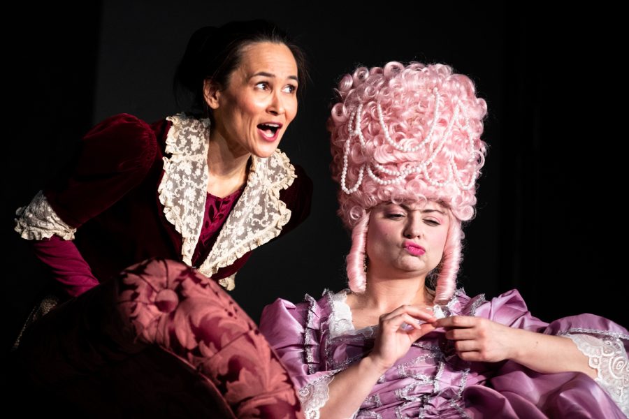 Kristina Rutkowski, playing the role of Olympe de Gouges, talks with Eva Giacomo, playing the role of Marie-Antoinette, in a dress rehearsal of The Revolutionists at Dreamwell Theatre in Iowa City on Thursday, Feb. 24, 2022.